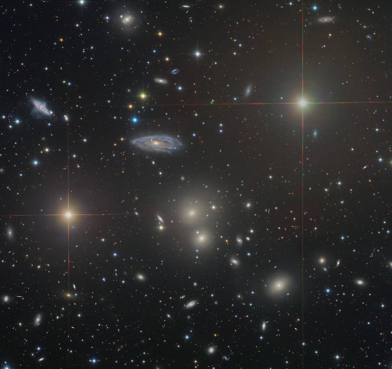 Hydra Cluster of Galaxies with spiral and elliptical galaxies among distant stars in NASA Space Pictures