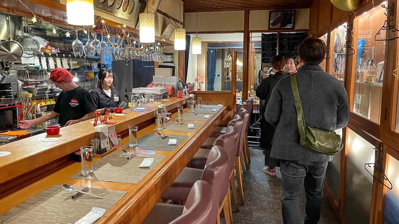 Interior of well-known Kichi Kichi restaurant in Kyoto, Japan where chef Motokichi Yukimura makes his famous omarice.