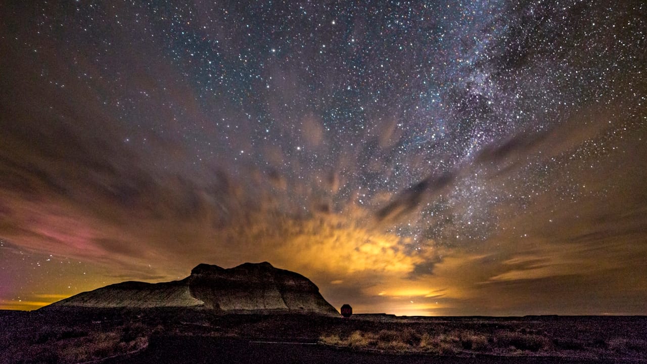 Incredible view of the Milky Way Galaxy above Battleship Rock in Petrified Forest National Park Arizona.
