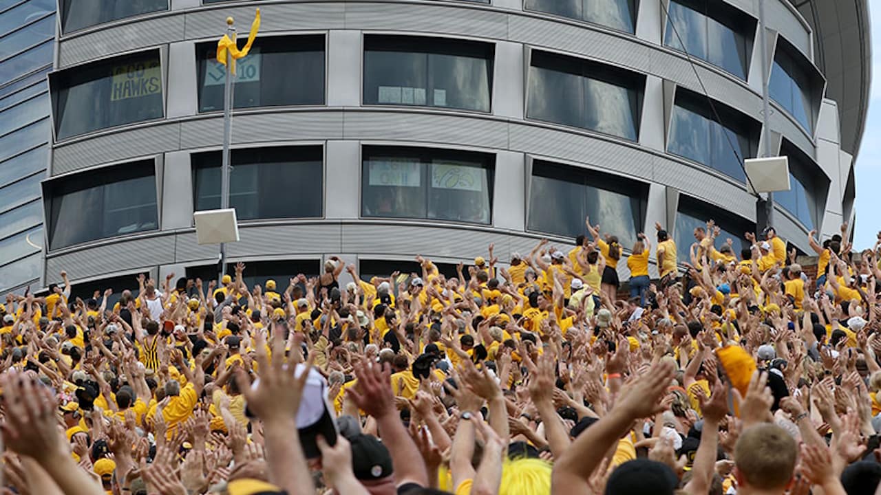 A large group of fans waves in unison to the UI Stead Family Children’s Hospital, sharing hope and kindness during a football game.