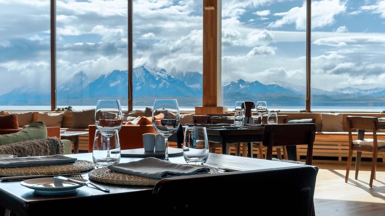 The Tierra Patagonia restaurant offers breathtaking views of the majestic Torres del Paine mountains and the tranquil waters of Lake Sarmiento.