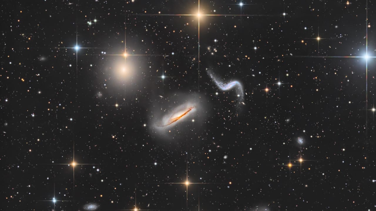 The spiral galaxy NGC 5993 in Draco, part of Hickson 44, reveals stunning cosmic interactions and distant star formation.