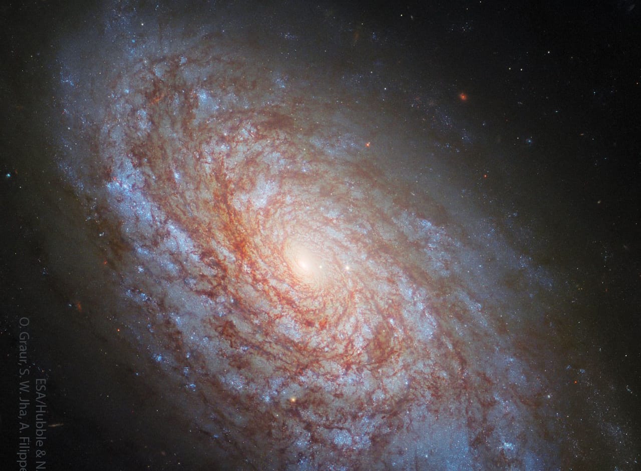 Hubble's image of NGC 4414, a flocculent spiral galaxy, showcasing its unique structure and the mystery of dark matter.