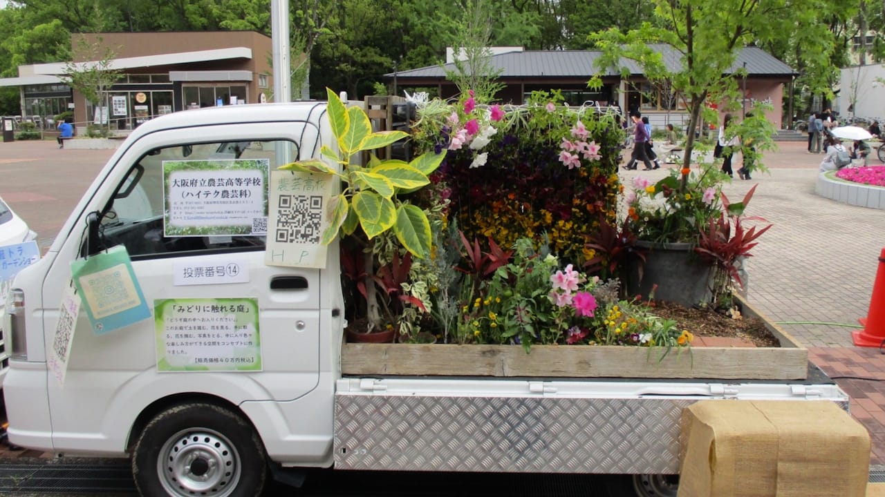 Kei Truck with a beautiful bright flower garden in the bed.