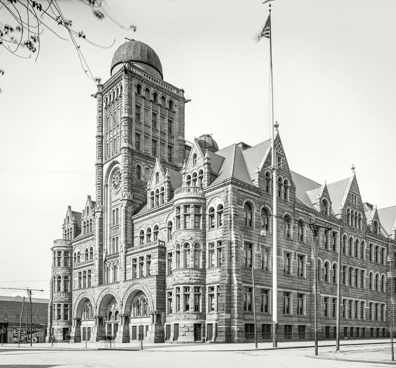 Black and white image showing the Central Boys High School, completed in 1900.